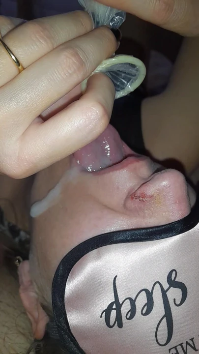The young whore swallows the sperm directly from the condom after passionate sex with the gifted boy