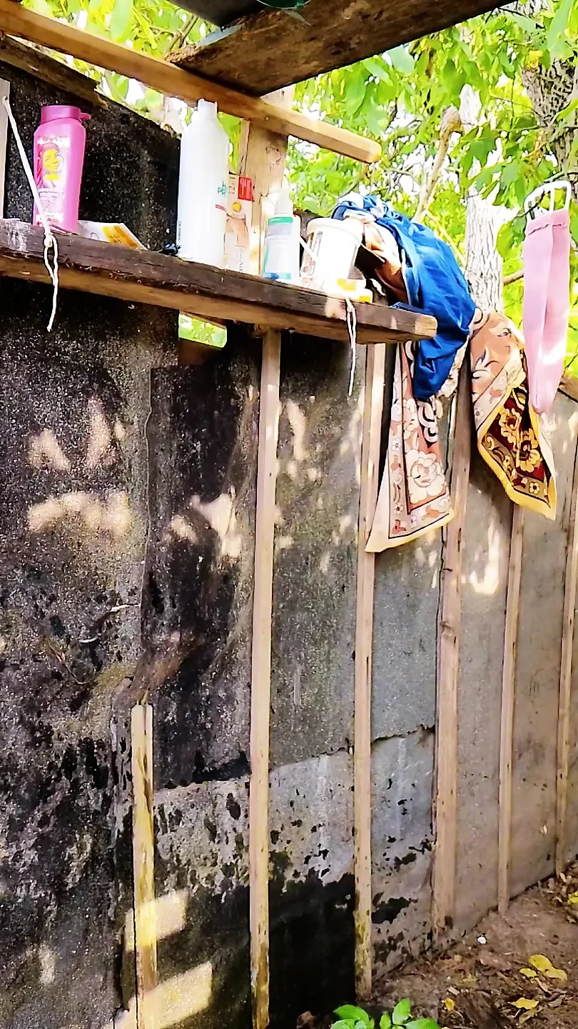 Wet naked body in the shower outside