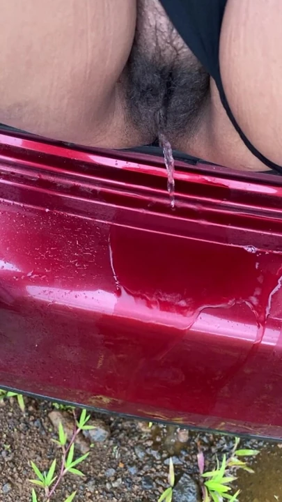 hot girl pissing on the way outside of the car boot