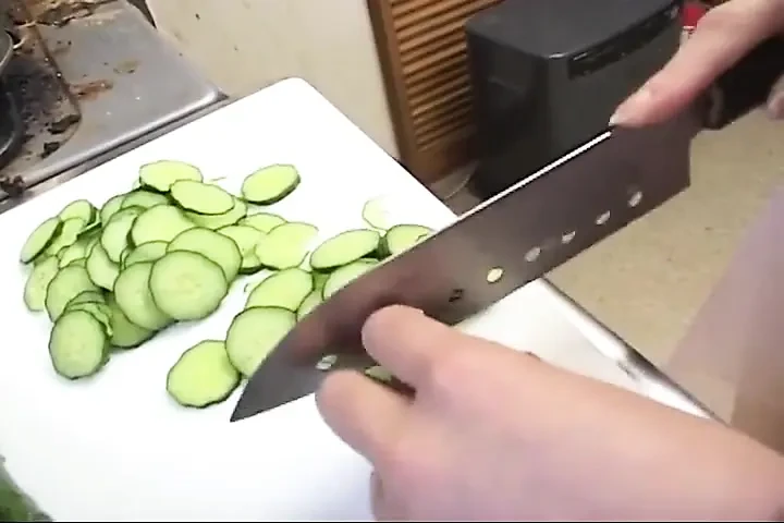 Insatiable Young Wife Drenches Cucumber Deep in Kitchen Sink